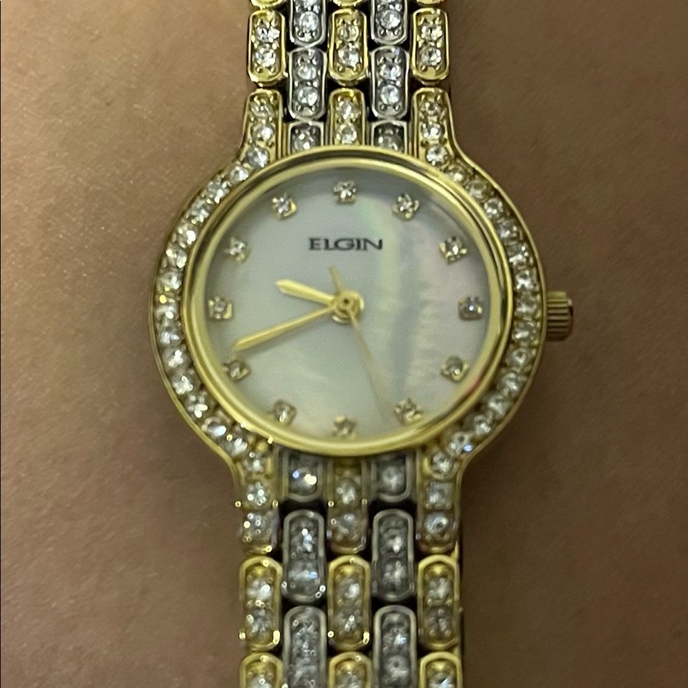 Beautiful gold plated watch with CZ diamonds and a pearl face.